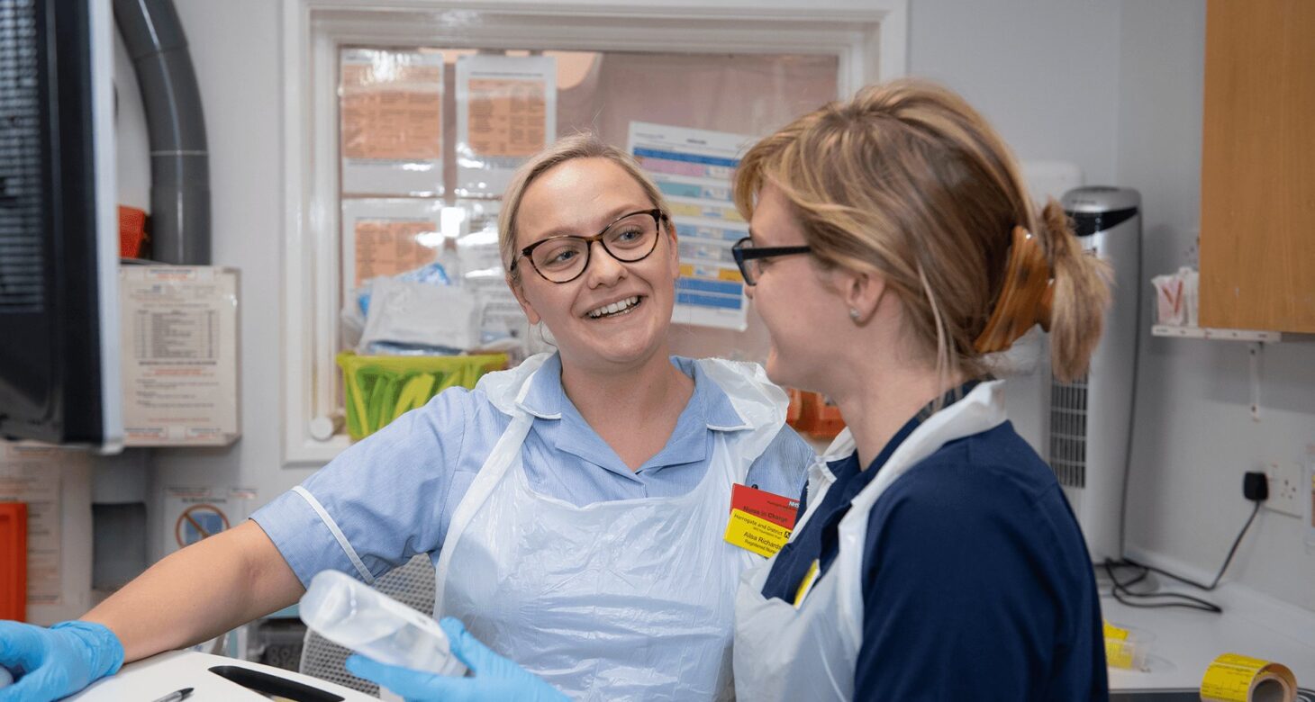 2 Harrogate nurses working together in the lab.